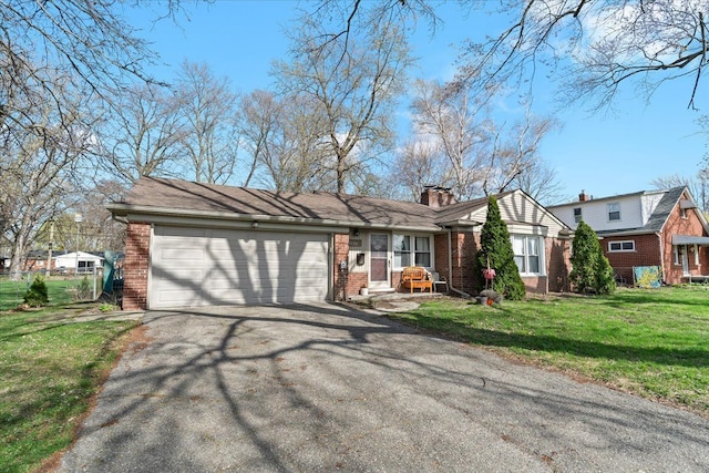 45520 Deshon St, Utica, MI 48317 - view of front of home with a chimney, aphalt driveway, brick siding, a front yard, and a garage