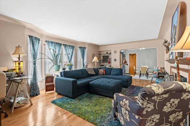 45520 Deshon St, Utica, MI 48317 - living area with arched walkways and wood-type flooring