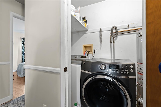 45520 Deshon St, Utica, MI 48317 - laundry room with wood finished floors, washer and clothes dryer, and laundry area