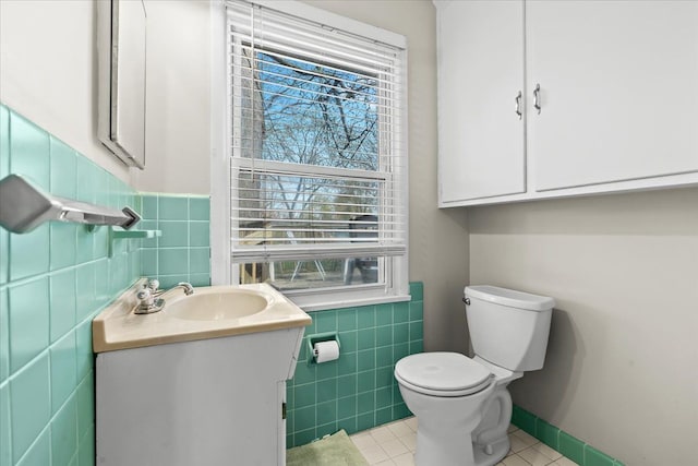 45520 Deshon St, Utica, MI 48317 - half bath with toilet, tile walls, wainscoting, tile patterned flooring, and vanity