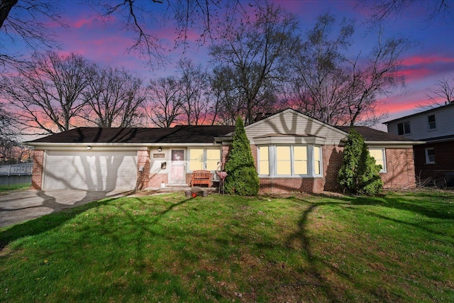45520 Deshon St, Utica, MI 48317 - view of front of house featuring concrete driveway, brick siding, and a garage