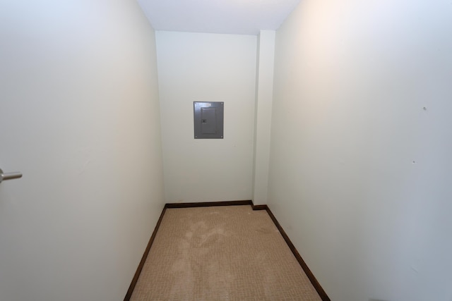 69369 Oak St, Benton Harbor, MI 49022 - hallway featuring electric panel, baseboards, and light colored carpet