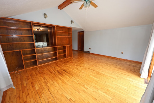 69369 Oak St, Benton Harbor, MI 49022 - additional living space featuring baseboards, ceiling fan, wood-type flooring, and vaulted ceiling with beams