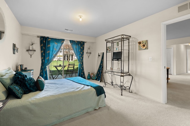 52140 Naugatuck Dr, Macomb, MI 48042 - carpeted bedroom with baseboards, visible vents, and access to exterior