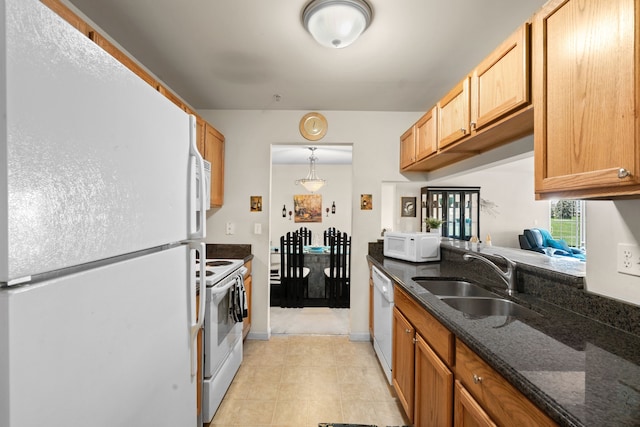 52140 Naugatuck Dr, Macomb, MI 48042 - kitchen with light tile patterned flooring, a sink, white appliances, dark stone countertops, and decorative light fixtures
