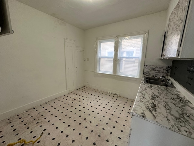 15815 Linwood St, Detroit, MI 48238 - unfurnished dining area with baseboards, visible vents, and a sink