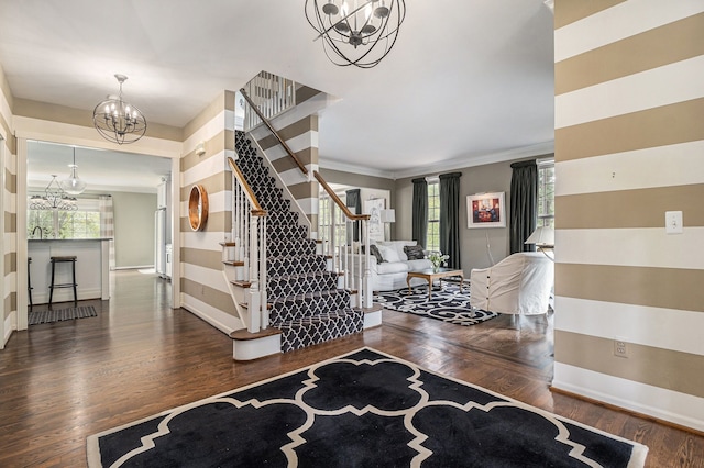 975 Pine Needle Trl, Rochester, MI 48306 - entrance foyer with a chandelier, stairs, baseboards, wood finished floors, and ornamental molding