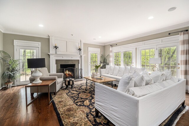 975 Pine Needle Trl, Rochester, MI 48306 - living room featuring healthy amount of natural light, a tile fireplace, dark wood-style flooring, recessed lighting, and crown molding