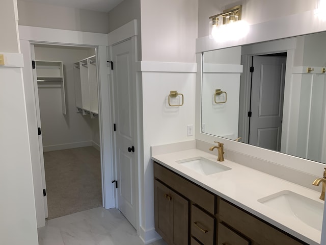 1060 N Wahington St, Lowell, MI 49331 - full bath featuring double vanity, marble look tiles, and a walk in closet