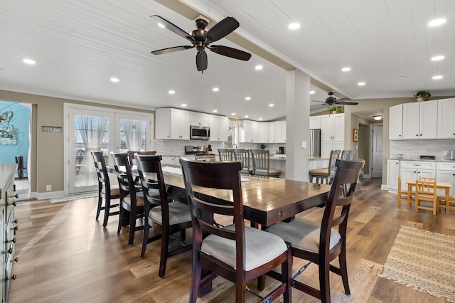 dining space with wooden ceiling, ornamental molding, a ceiling fan, light wood-style floors, and recessed lighting