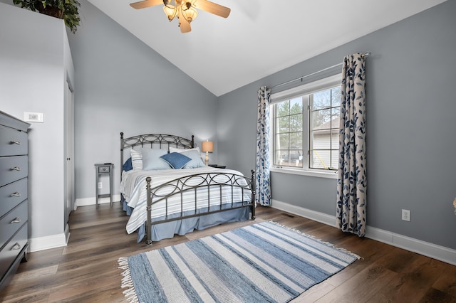 bedroom with lofted ceiling, baseboards, wood finished floors, and ceiling fan