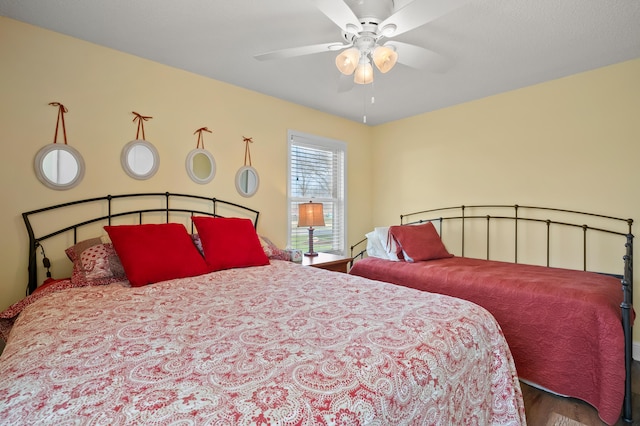 bedroom with ceiling fan and wood finished floors