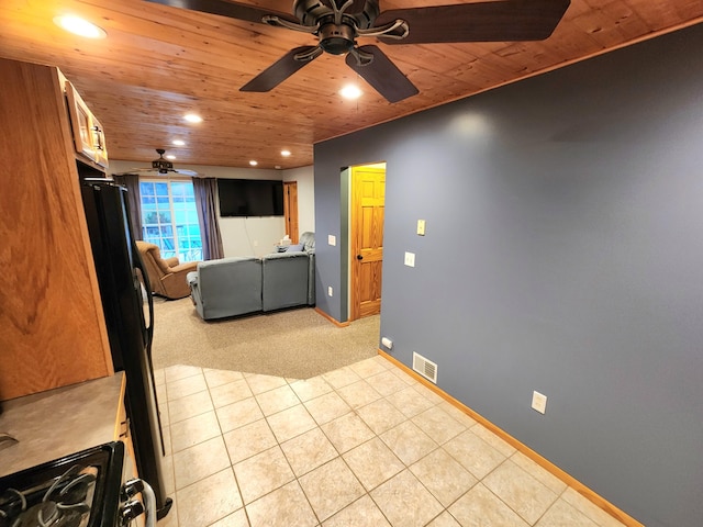 6039 W Morris Lake Rd, Mears, MI 49436 - living area with a ceiling fan, light carpet, wooden ceiling, visible vents, and recessed lighting