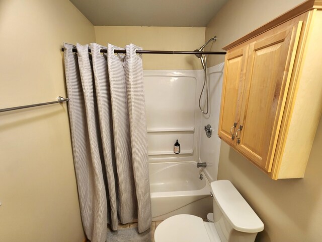 6039 W Morris Lake Rd, Mears, MI 49436 - bathroom featuring shower / tub combo with curtain and toilet