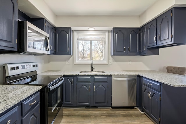 20100 Wick Rd, Taylor, MI 48180 - kitchen with dark wood-style flooring, a healthy amount of sunlight, stainless steel appliances, and a sink