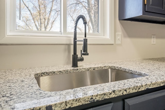 20100 Wick Rd, Taylor, MI 48180 - room details featuring light stone countertops and a sink