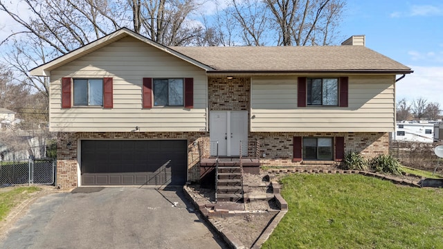 20100 Wick Rd, Taylor, MI 48180 - split foyer home featuring brick siding, driveway, and a garage