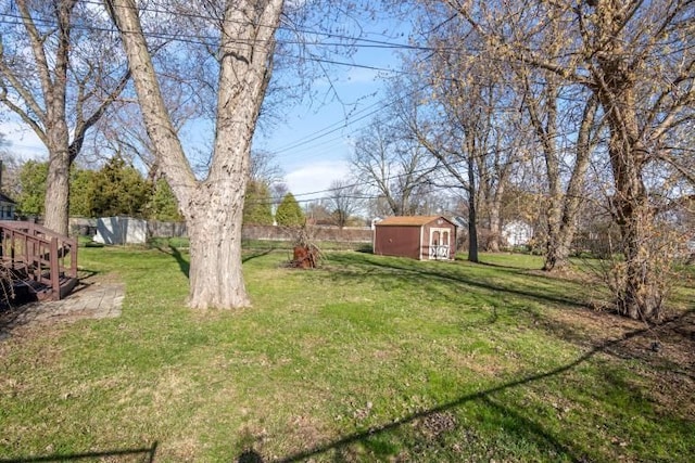 20100 Wick Rd, Taylor, MI 48180 - view of yard with a storage unit, an outbuilding, and fence