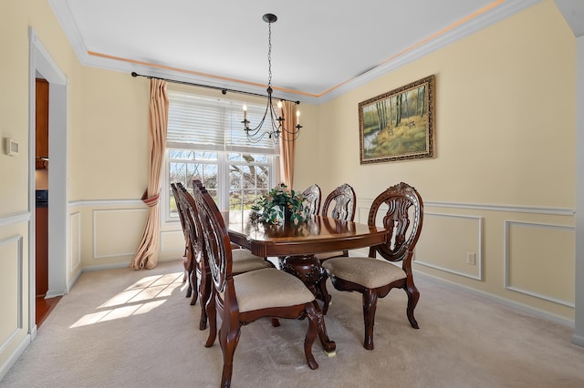 7511 Dunross Dr, Portage, MI 49024 - dining room with light colored carpet, a decorative wall, crown molding, and a chandelier