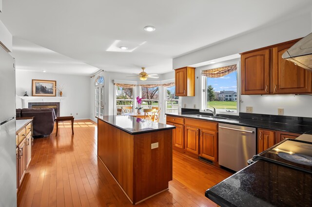 7511 Dunross Dr, Portage, MI 49024 - kitchen featuring a center island, a sink, hardwood / wood-style flooring, dishwasher, and ceiling fan
