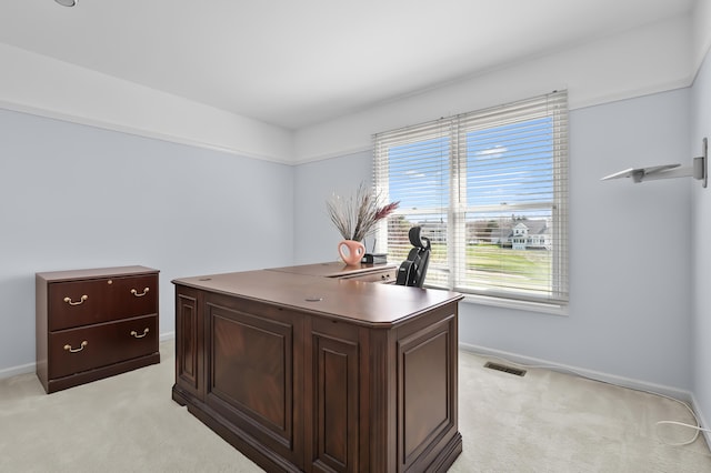 7511 Dunross Dr, Portage, MI 49024 - office area featuring light colored carpet, baseboards, and plenty of natural light