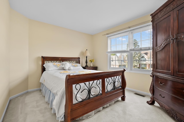 7511 Dunross Dr, Portage, MI 49024 - bedroom featuring light carpet, baseboards, and visible vents
