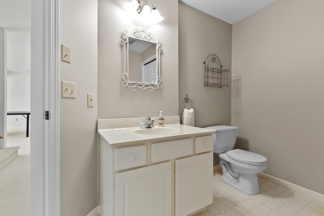7511 Dunross Dr, Portage, MI 49024 - bathroom featuring baseboards, vanity, tile patterned flooring, and toilet