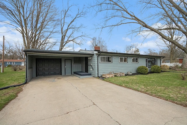 ranch-style house featuring a garage, a front lawn, a chimney, and concrete driveway