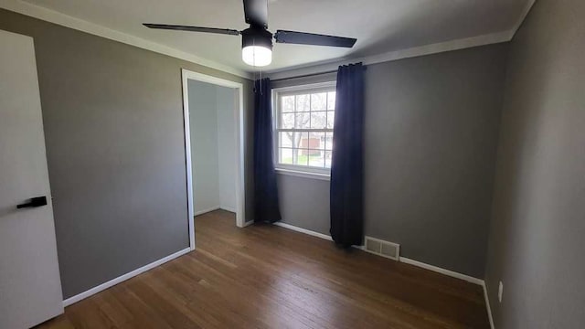 23528 King Dr, Clinton Township, MI 48035 - unfurnished room with crown molding, a ceiling fan, visible vents, baseboards, and wood finished floors