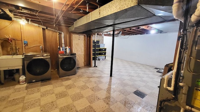 23528 King Dr, Clinton Township, MI 48035 - unfinished below grade area featuring tile patterned floors, separate washer and dryer, and a sink