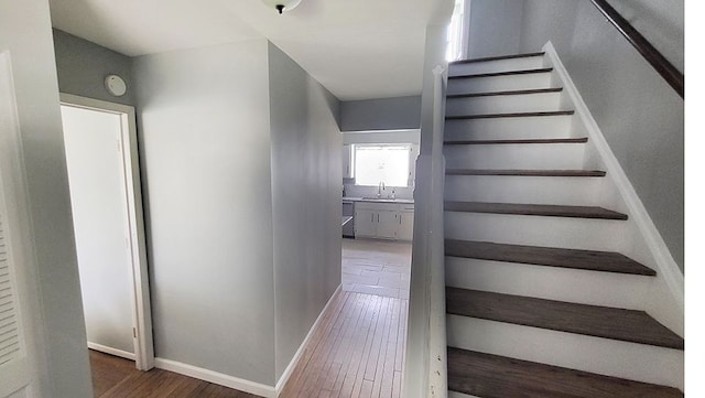 23528 King Dr, Clinton Township, MI 48035 - staircase with wood finished floors and baseboards