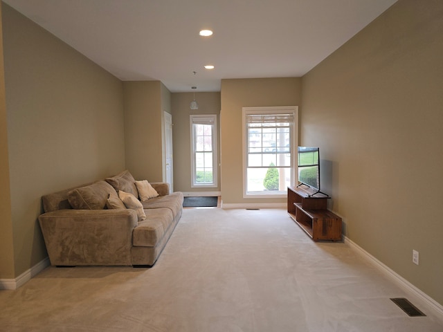 45645 Graystone Ln, Canton, MI 48187 - living area with light colored carpet, baseboards, and recessed lighting
