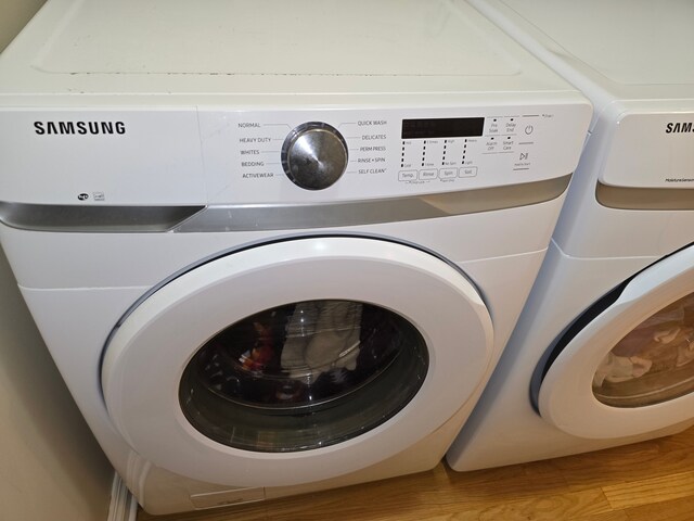 45645 Graystone Ln, Canton, MI 48187 - laundry area featuring independent washer and dryer and light wood-style floors