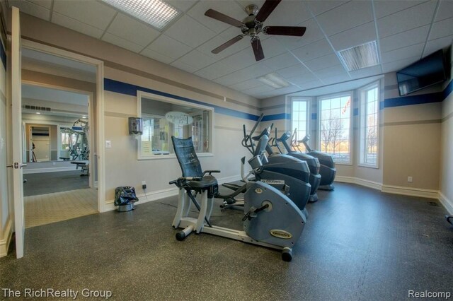 45645 Graystone Ln, Canton, MI 48187 - exercise room featuring baseboards, ceiling fan, and a paneled ceiling