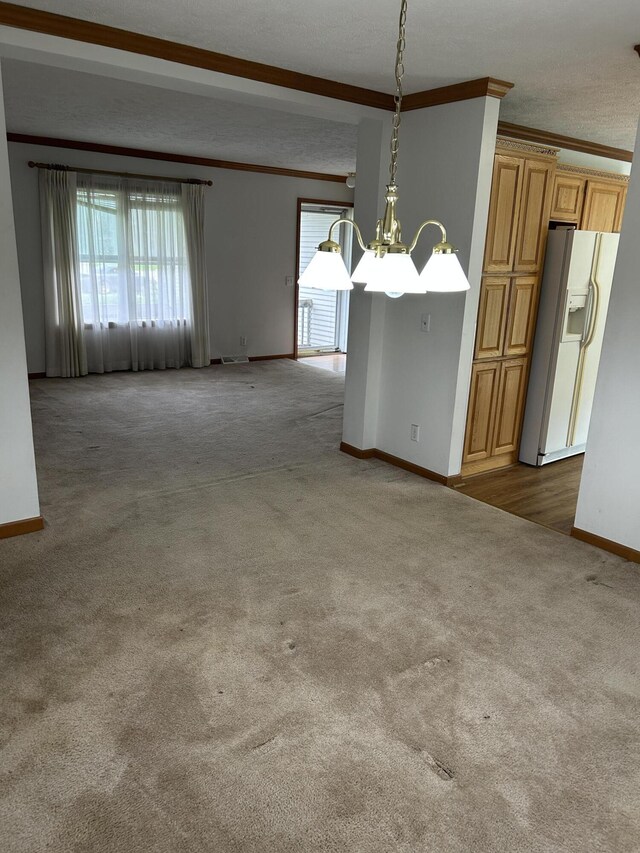 4 Grady Ct, Coldwater, MI 49036 - carpeted spare room with ornamental molding, a chandelier, and plenty of natural light