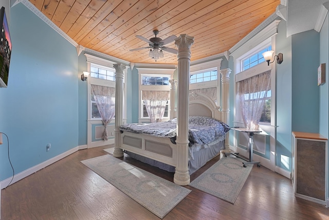 bedroom featuring ornamental molding, baseboards, decorative columns, and wood ceiling