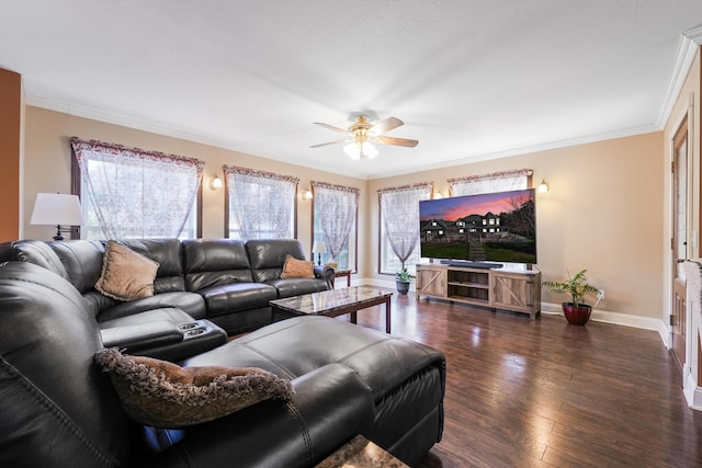 living area with ornamental molding, a ceiling fan, baseboards, and hardwood / wood-style flooring
