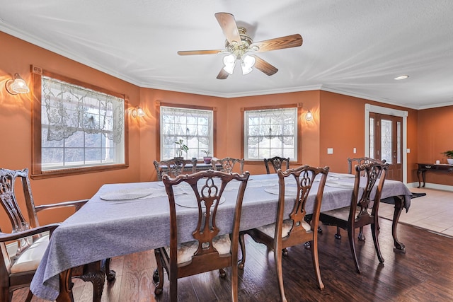 dining room with recessed lighting, wood finished floors, a ceiling fan, french doors, and crown molding
