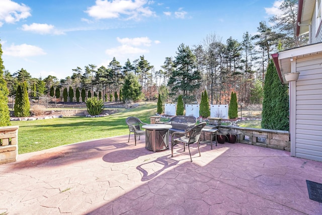 view of patio / terrace with an outdoor fire pit