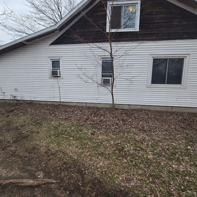 view of side of home with cooling unit