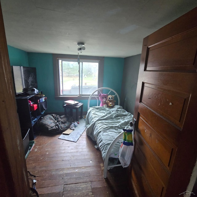 bedroom with hardwood / wood-style floors