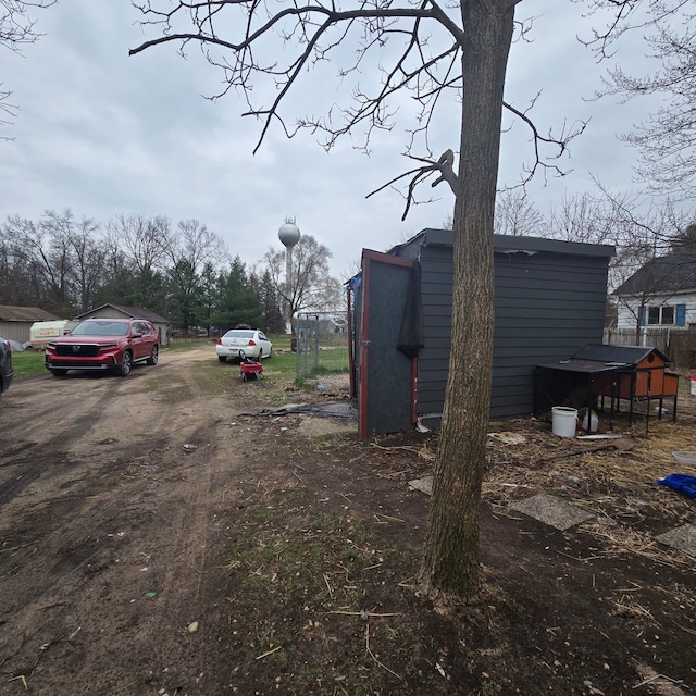 view of yard with dirt driveway