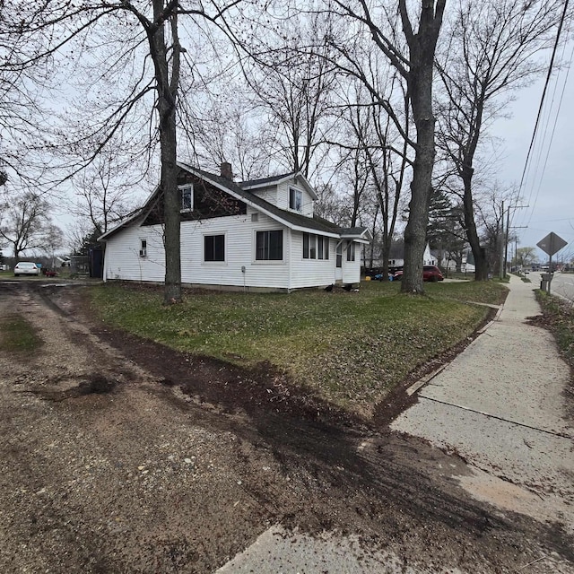 view of home's exterior with a chimney