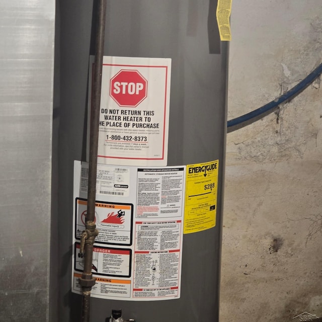 utility room featuring gas water heater