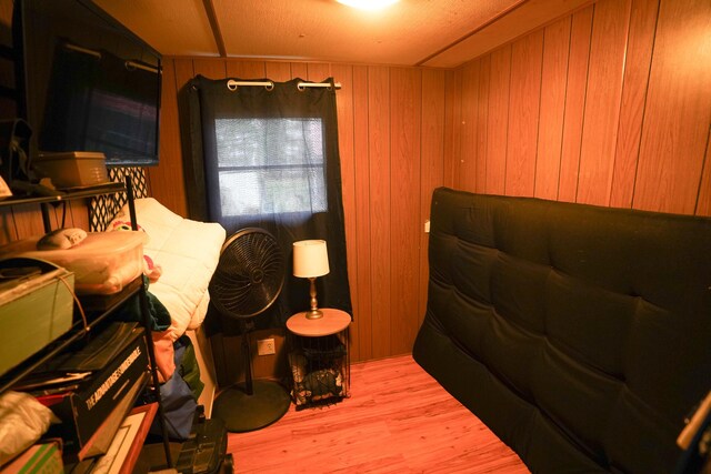 1786 S Camp Ave, White Cloud, MI 49349 - bedroom featuring wood finished floors and wood walls