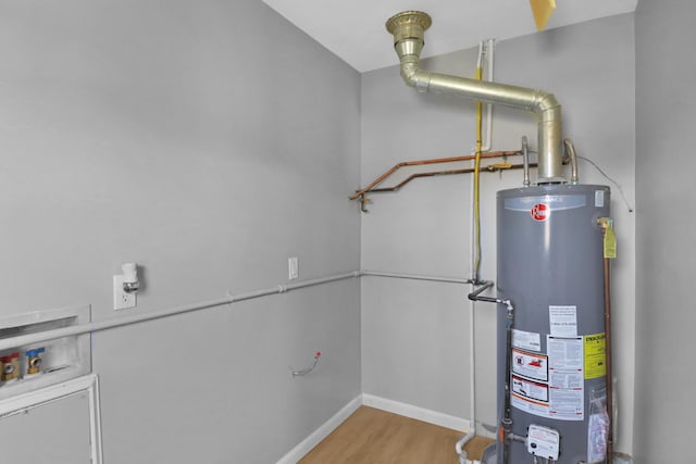 utility room featuring gas water heater
