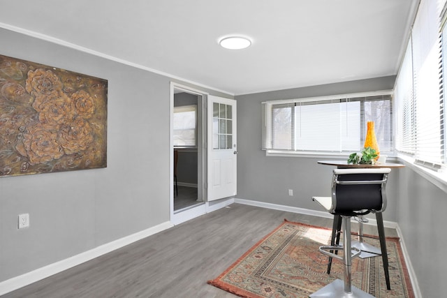 sitting room with wood finished floors and baseboards