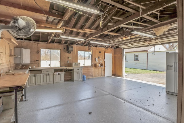 garage featuring wood walls