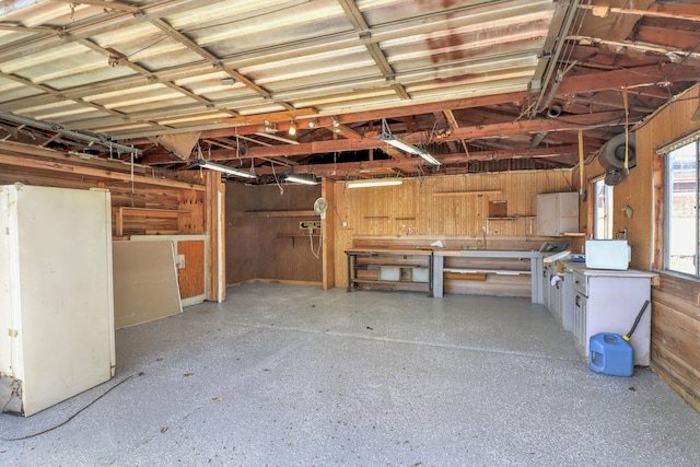 garage featuring wood walls