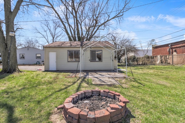 view of outbuilding featuring a fire pit
